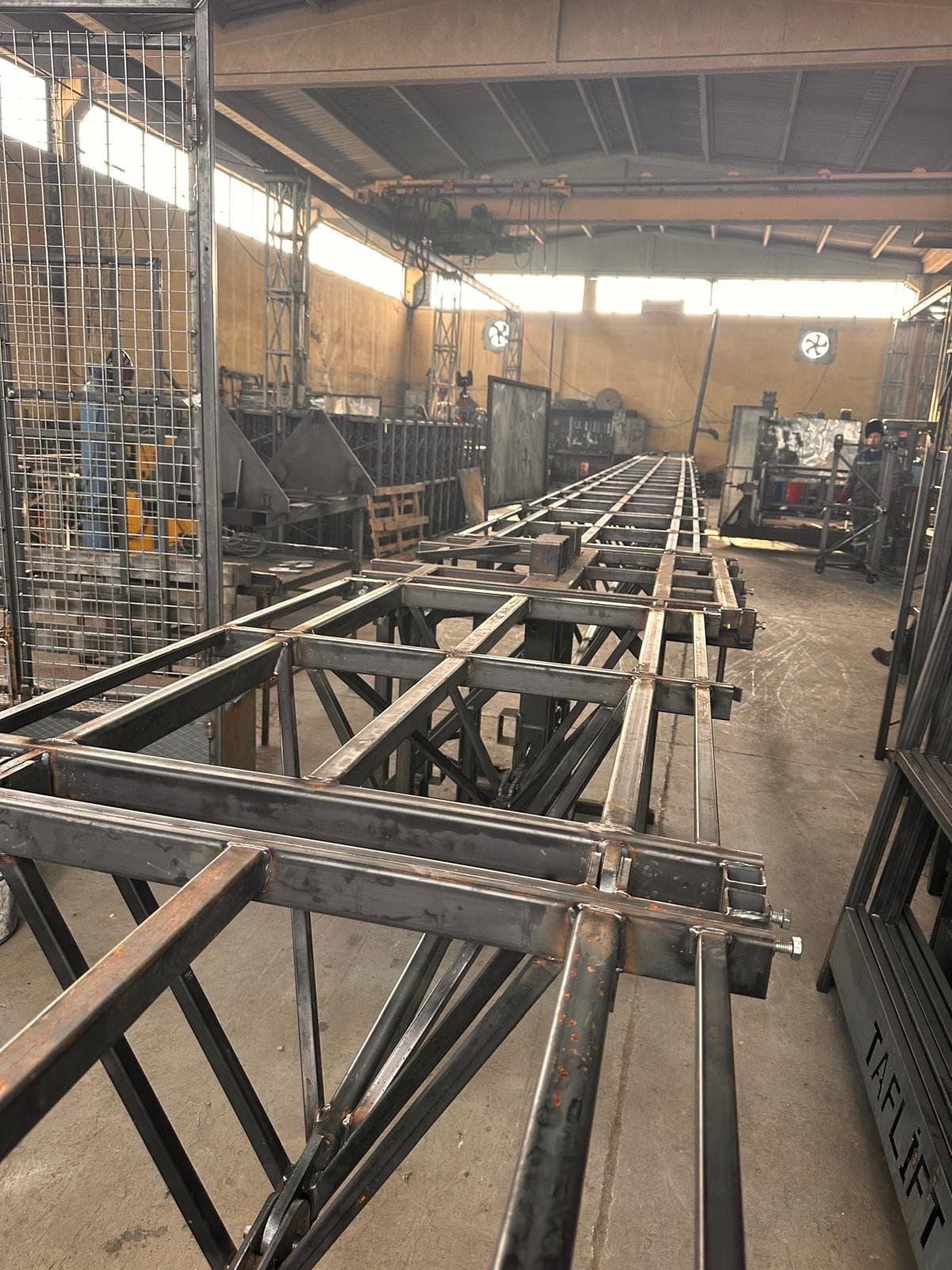 Welded steel framework for platform chassis inside the ALPMAKSAN fabrication workshop